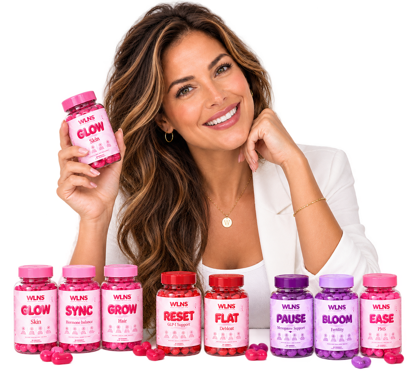 WLNS founder smiling with the full range of gummy bottles lined up in front of her
